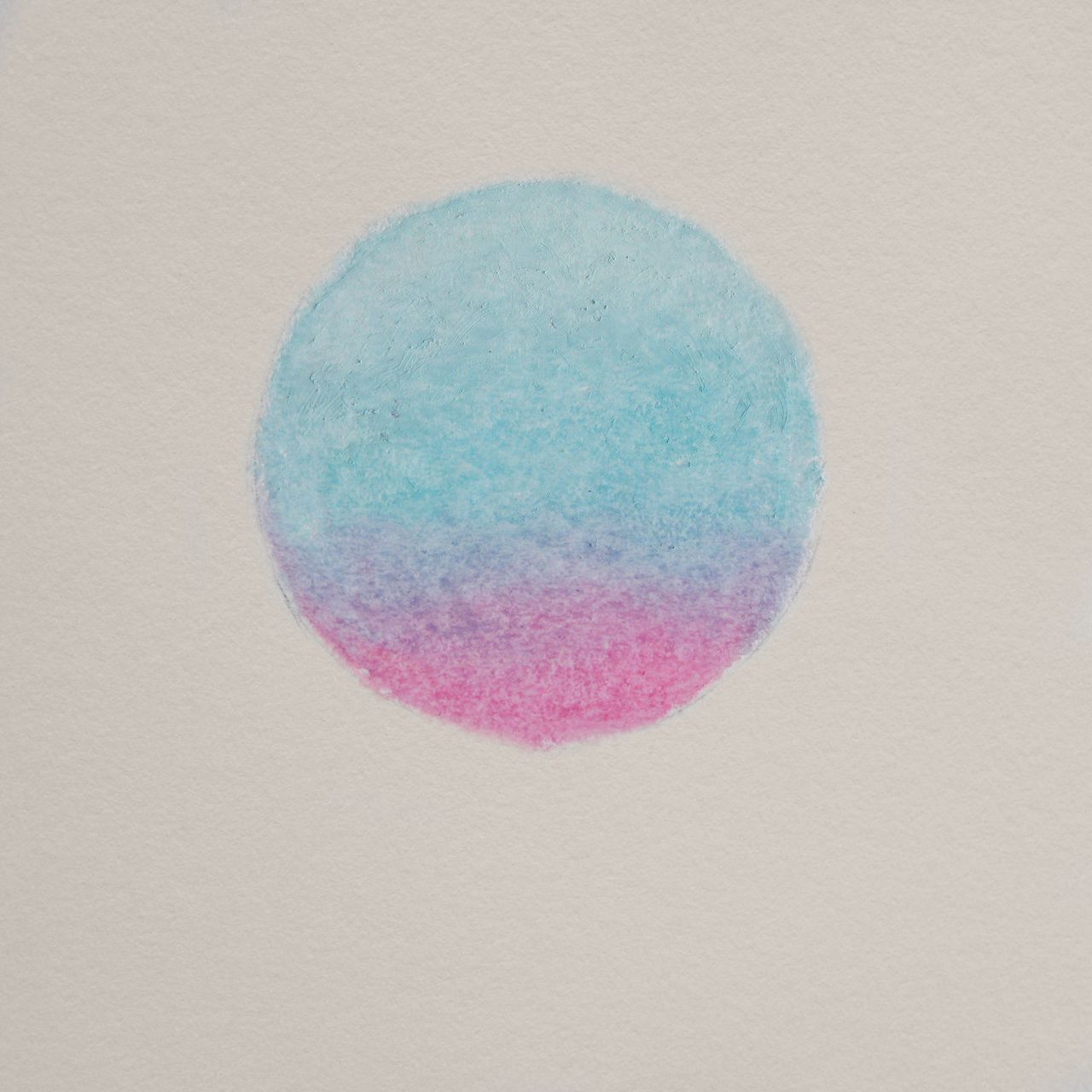 The artwork for this release. A pastel circle on a textured paper background. The circle fades from yellow lower left, through red at the centre, to black at the upper right.